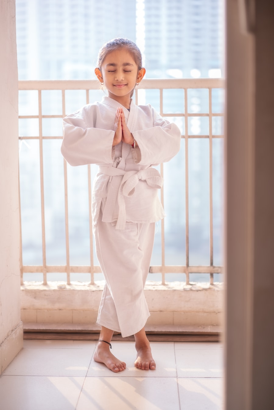 Child in yoga prayer pose