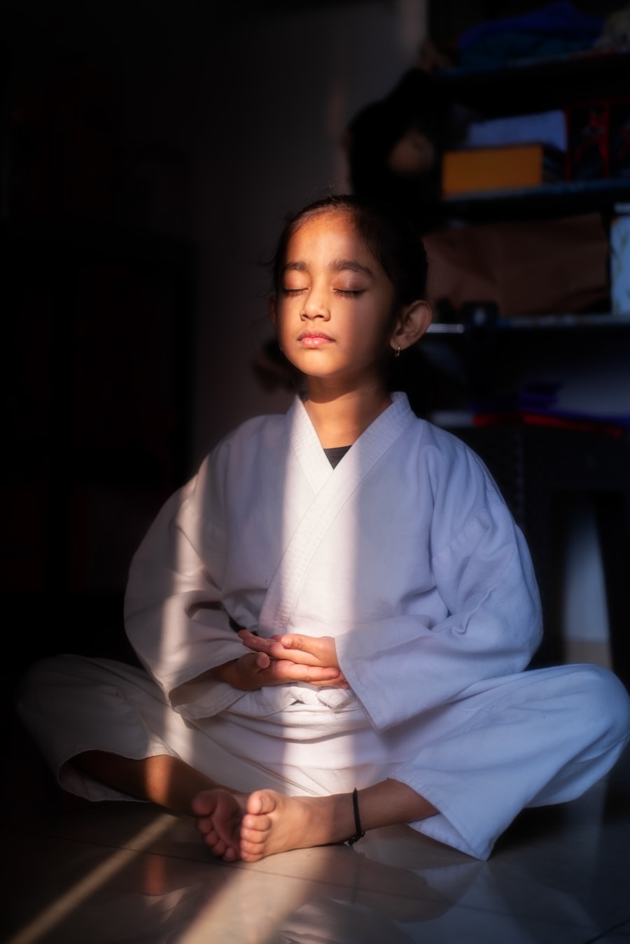 Child meditating in yoga class